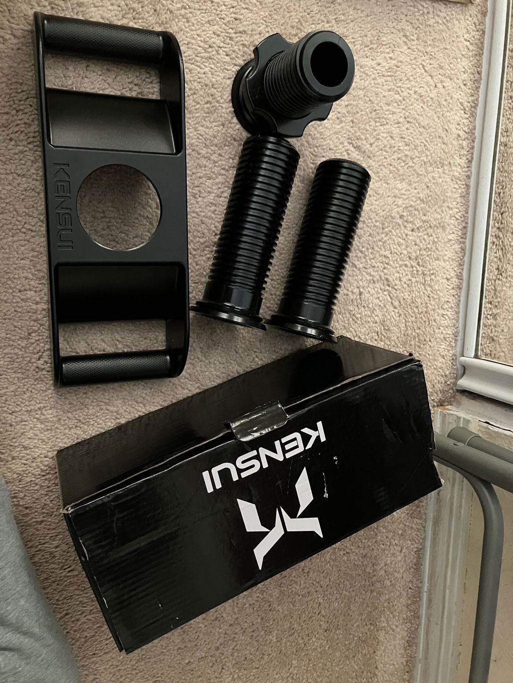 Neck harness parts and box unpacked on a carpet