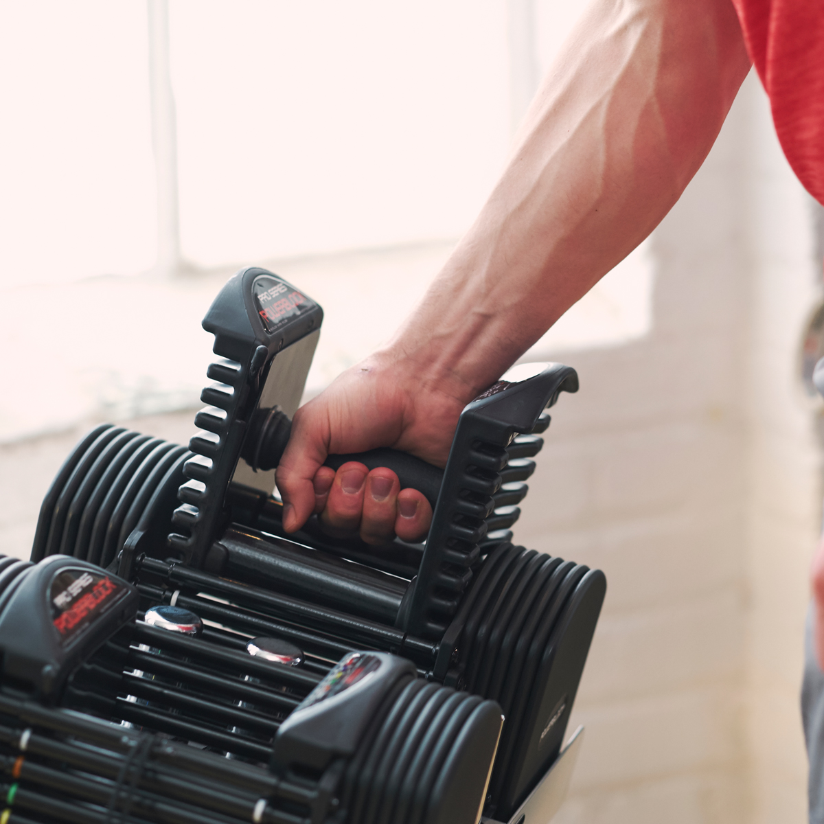 PowerBlock adjustable dumbbell with selector pin system